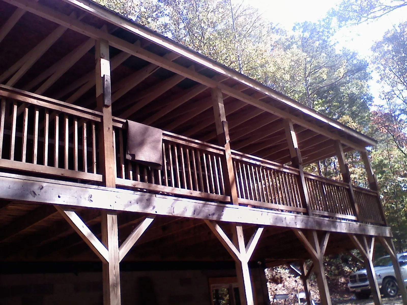 Timber framing under a new elevated porch and deck — Roof Leak Repair in Lacona by Roofing Brothers